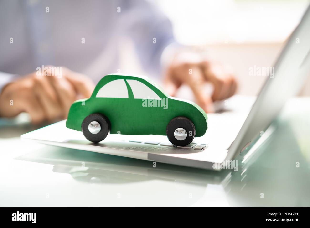 Blue Car On Laptop Keypad Stock Photo