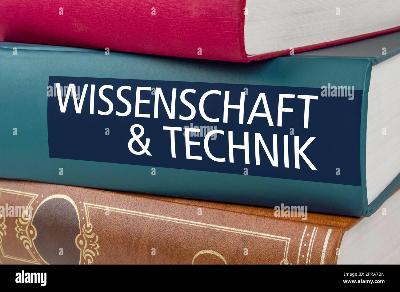 A book with the title Science and Technology written on the spine - Wissenschaft und Technik (German) Stock Photo