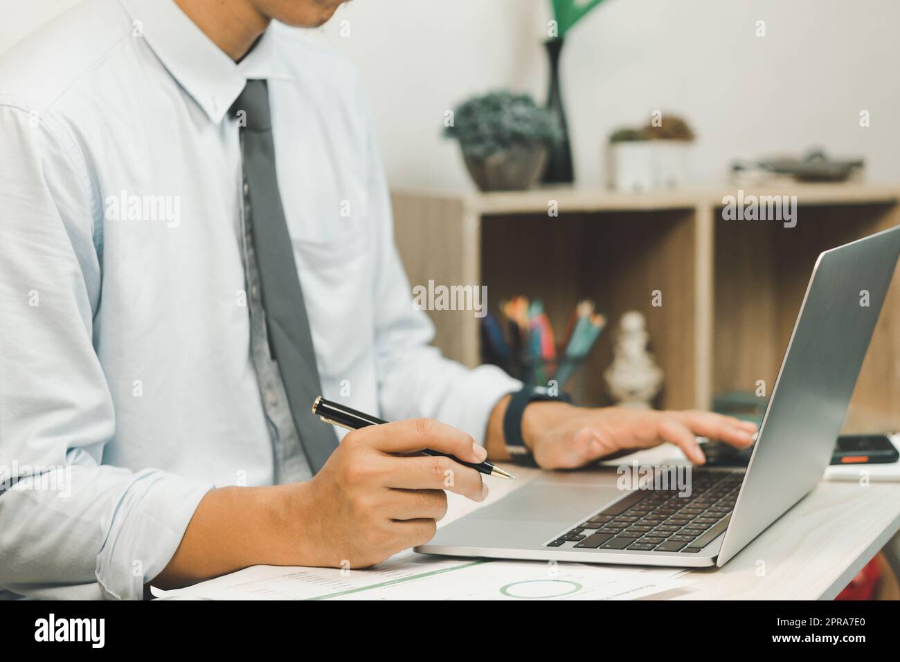 Hand man using keyboard computer laptop digital internet technology network browsing and shopping online and social media. Stock Photo