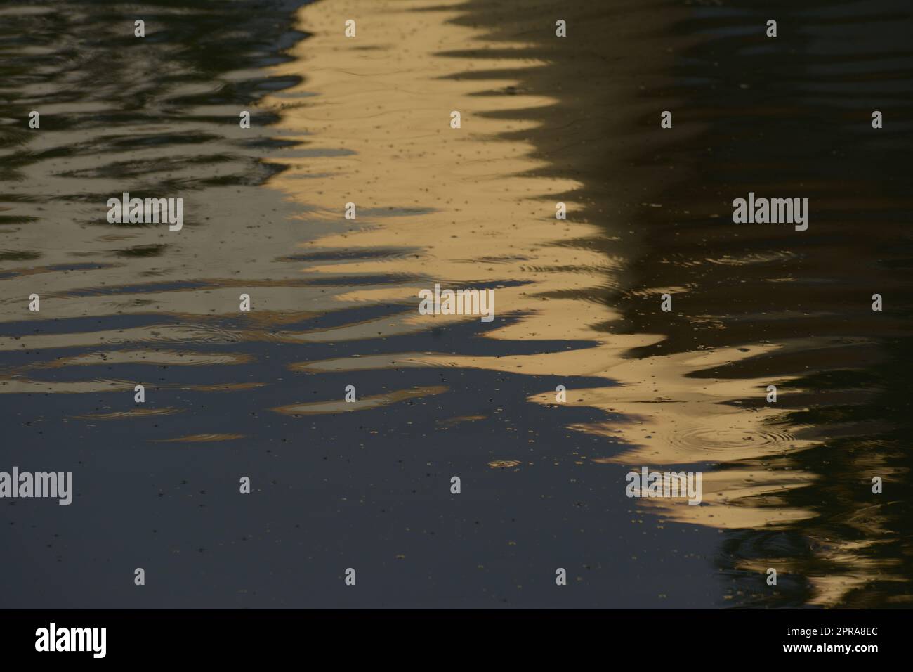 Abstract water surface with reflected sunlight from buildings Stock ...