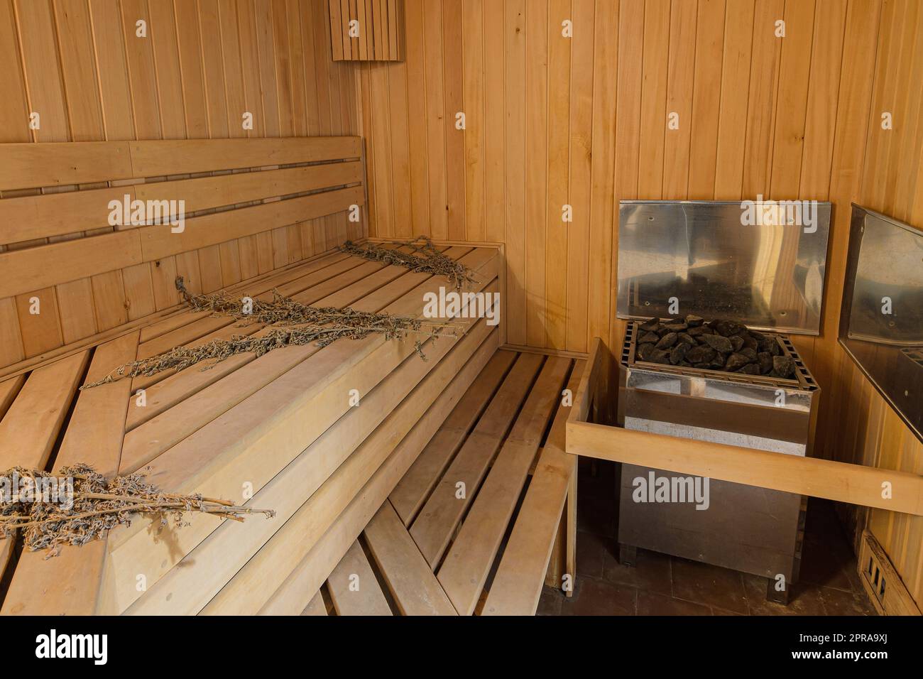 Interior of a sauna in a private house with an electric boiler Stock Photo