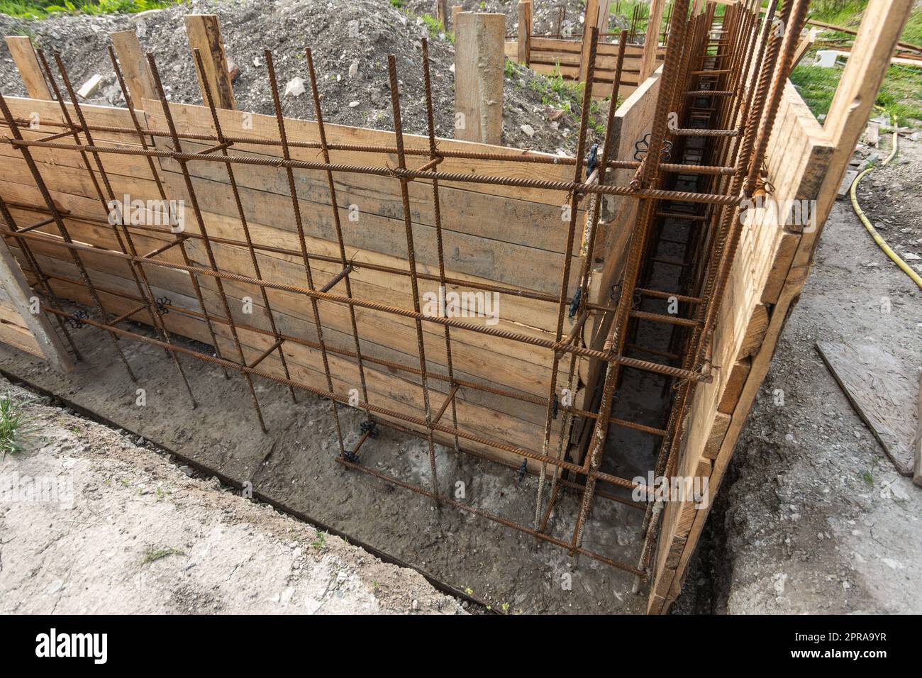 Tied rebar and mounted formwork closeup before pouring the strip