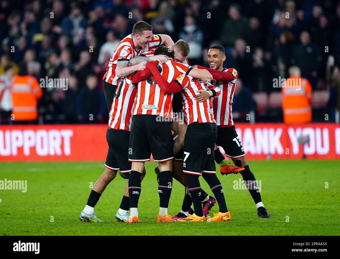 Sheffield United players celebrate being promoted to the Premier League