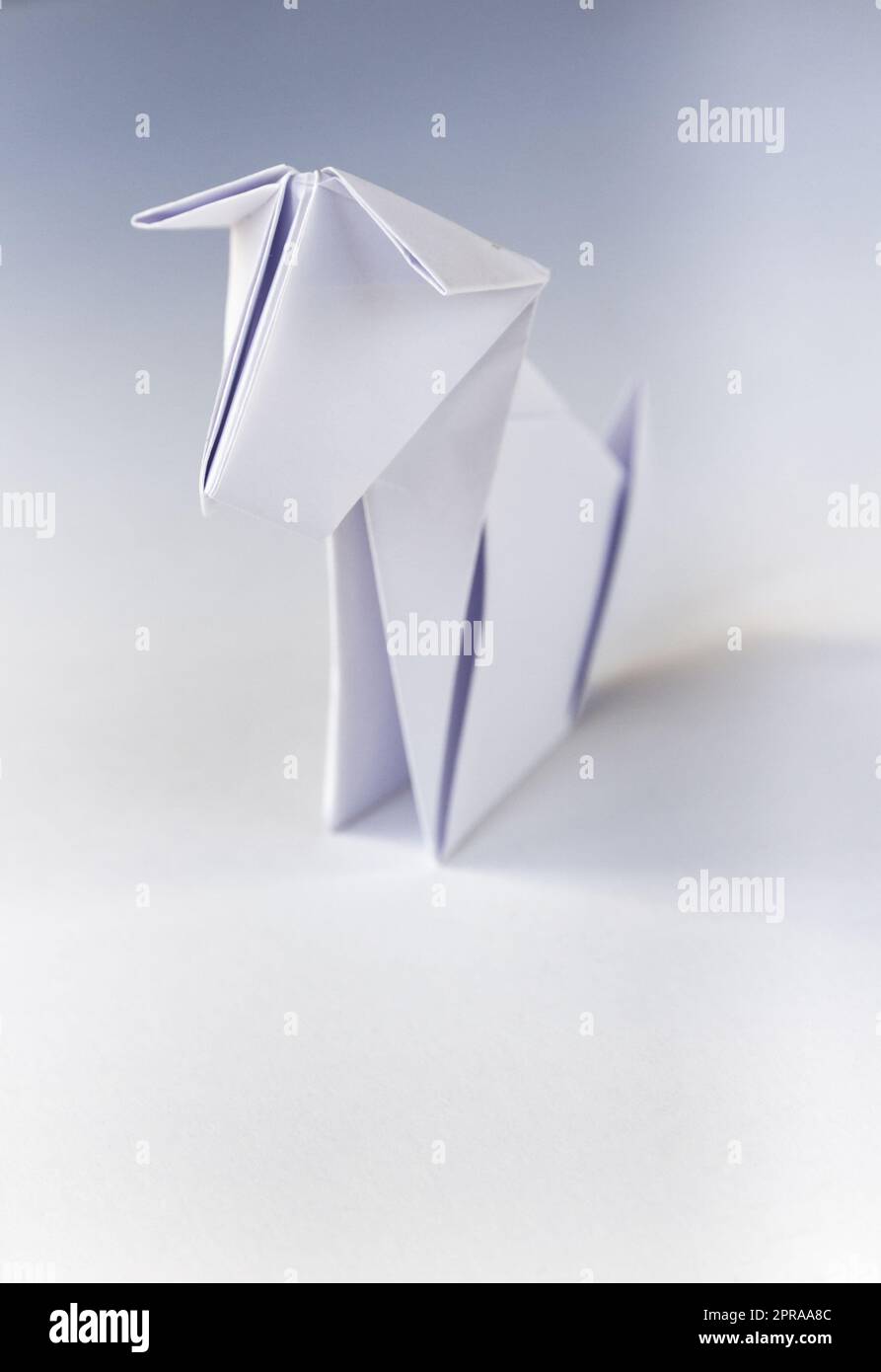 Paper dog origami isolated on a white background Stock Photo