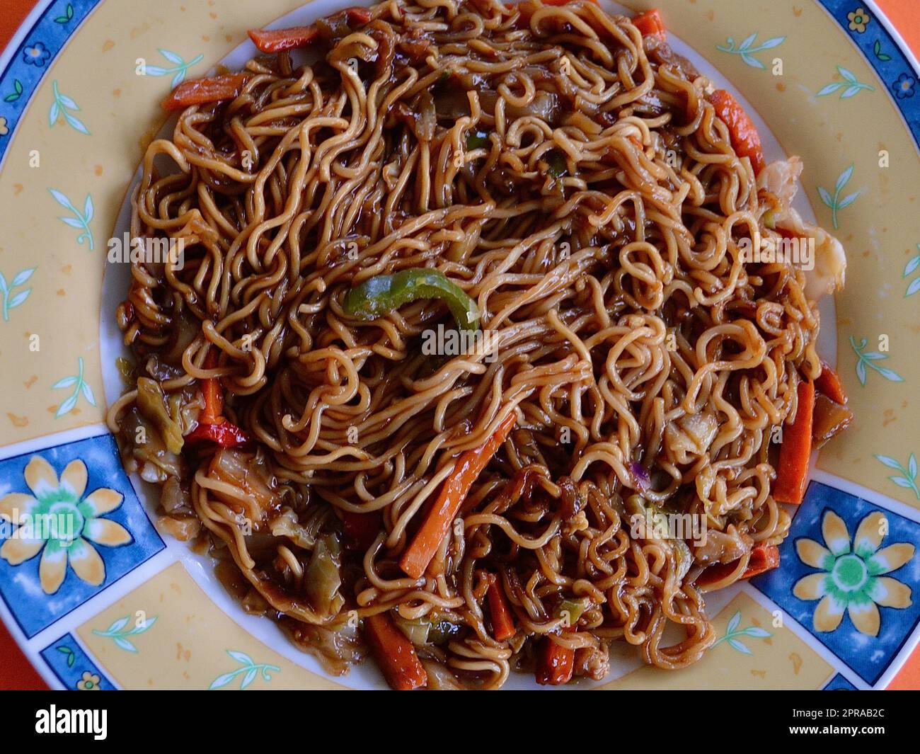 Mi Goreng on a colorful plate Stock Photo