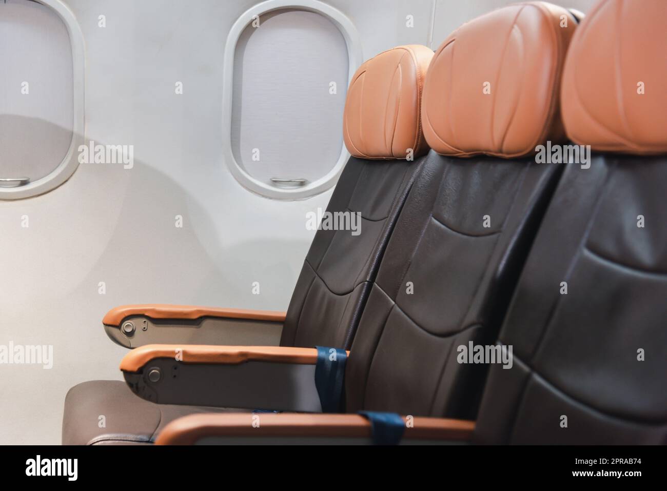 Empty aircraft seats and windows, passenger seat interior airplane Stock Photo