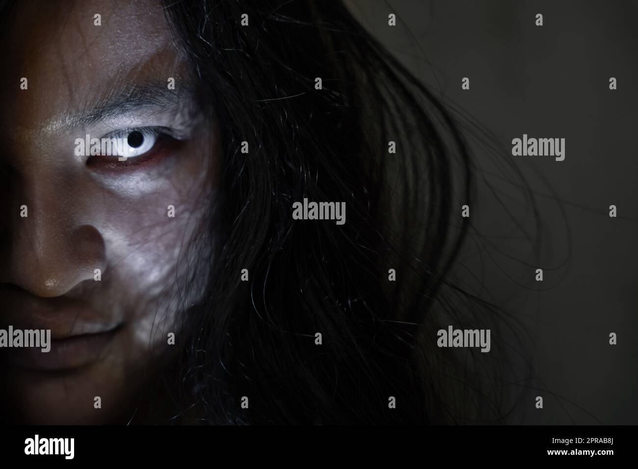 Close up face of Asian woman ghost or zombie horror creepy scary Stock Photo