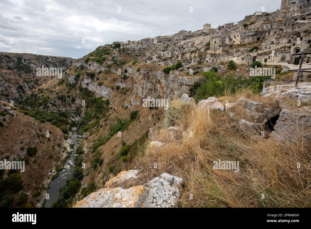 View of Gravina river canyon and park of the Rupestrian Churches of Matera with houses in caves di Murgia Timone near ancient town Matera (Sassi), , Basilicata,  Italy Stock Photo