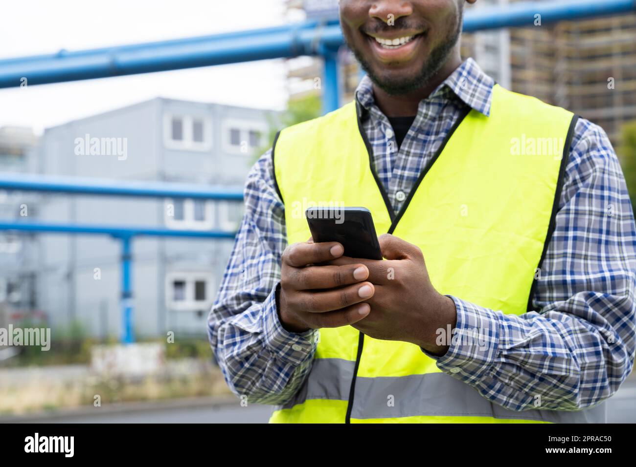 Builder Worker Using Phone Stock Photo