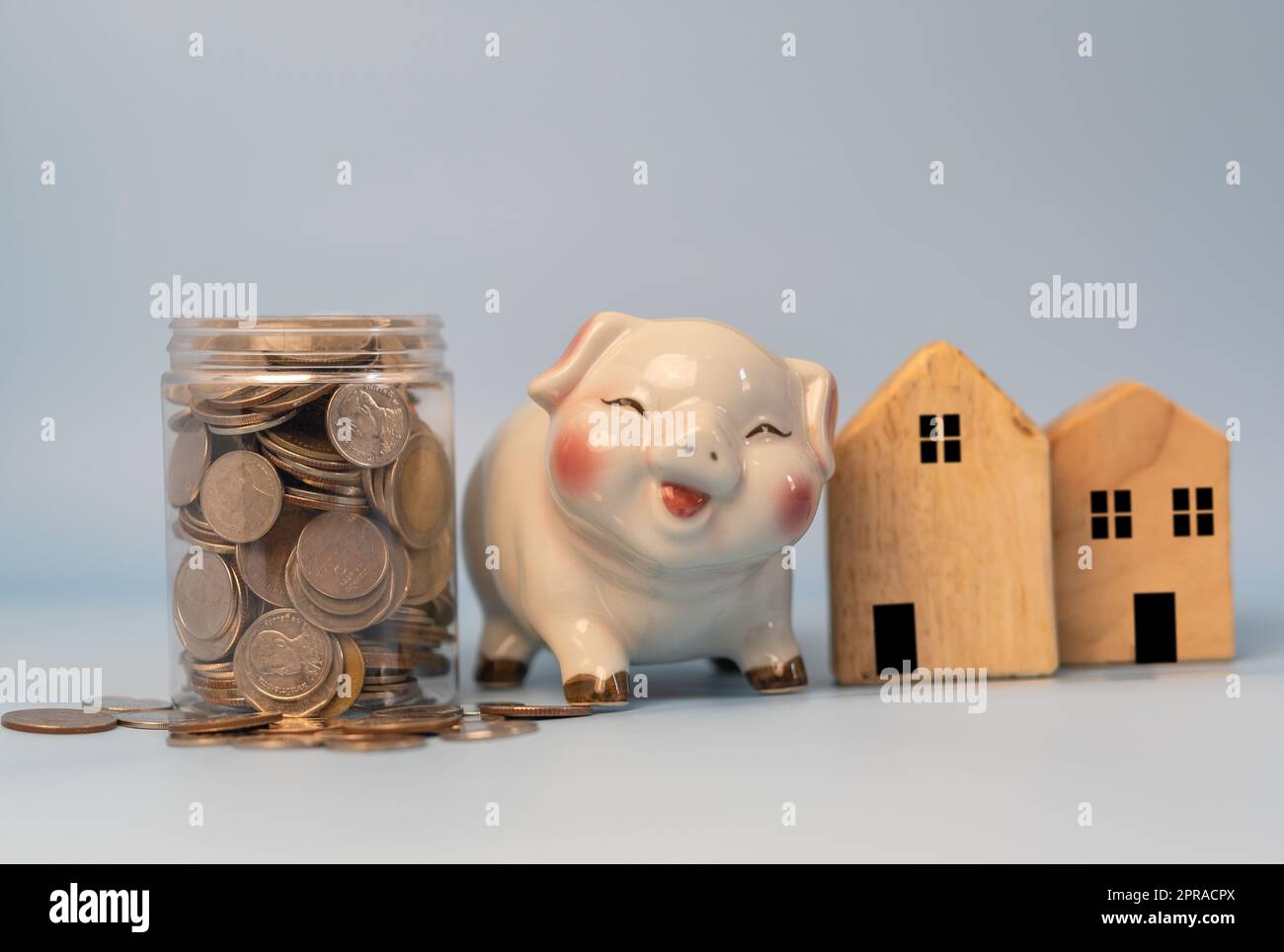 Saving money business finance, banking and investment in real estate or buying and selling houses. Stock Photo