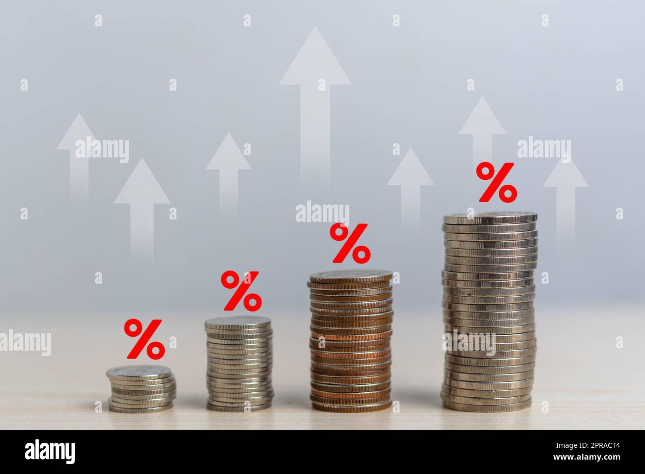 Coins stacked with percentages and arrows. Business Finance Inflation