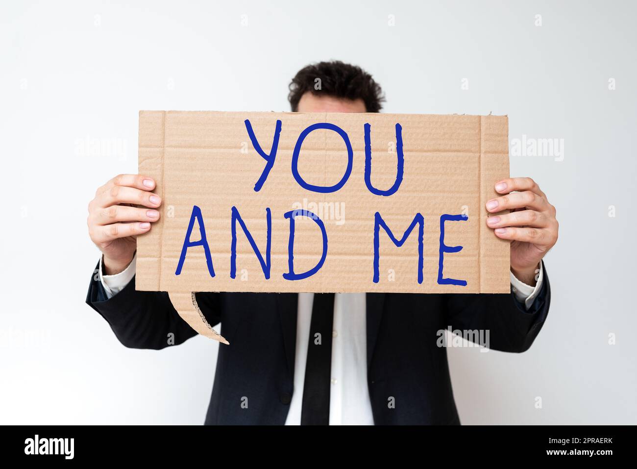 Text caption presenting You And Me. Business approach Couple Relationship compromise Expressing romantic feelings Businessman Holding Speech Bubble With Important Informations. Stock Photo