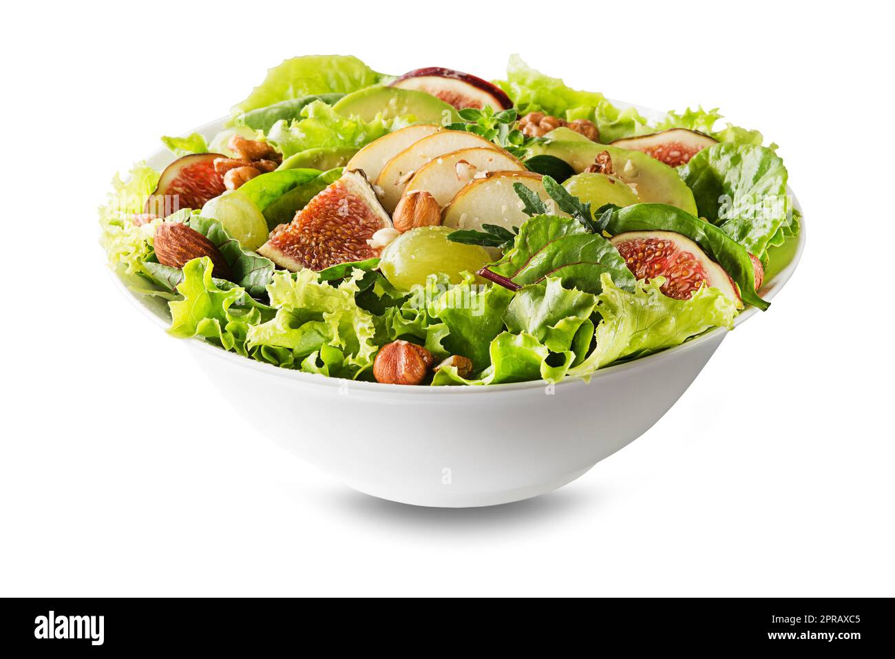 Fresh green leafy salad with fruits and nuts isolated on white
