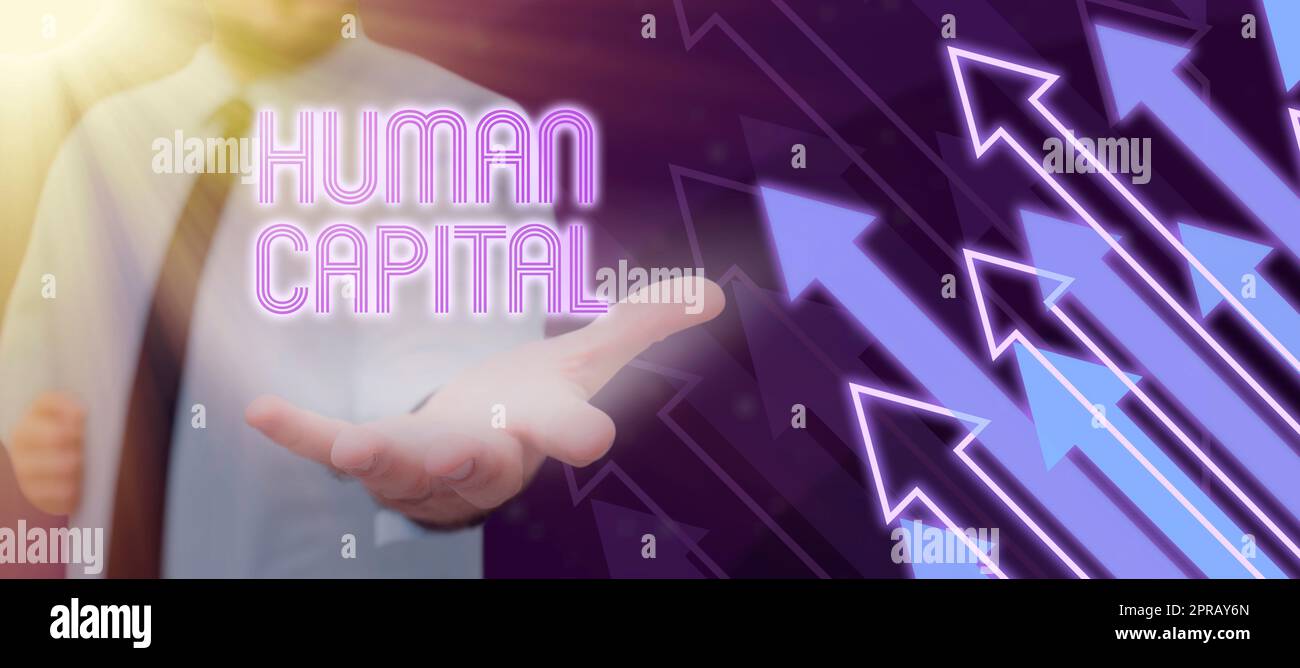 Handwriting text Human Capital. Business approach Intangible Collective Resources Competence Capital Education Man With Glowing Hand Presenting Crucial Information In A Meeting. Stock Photo
