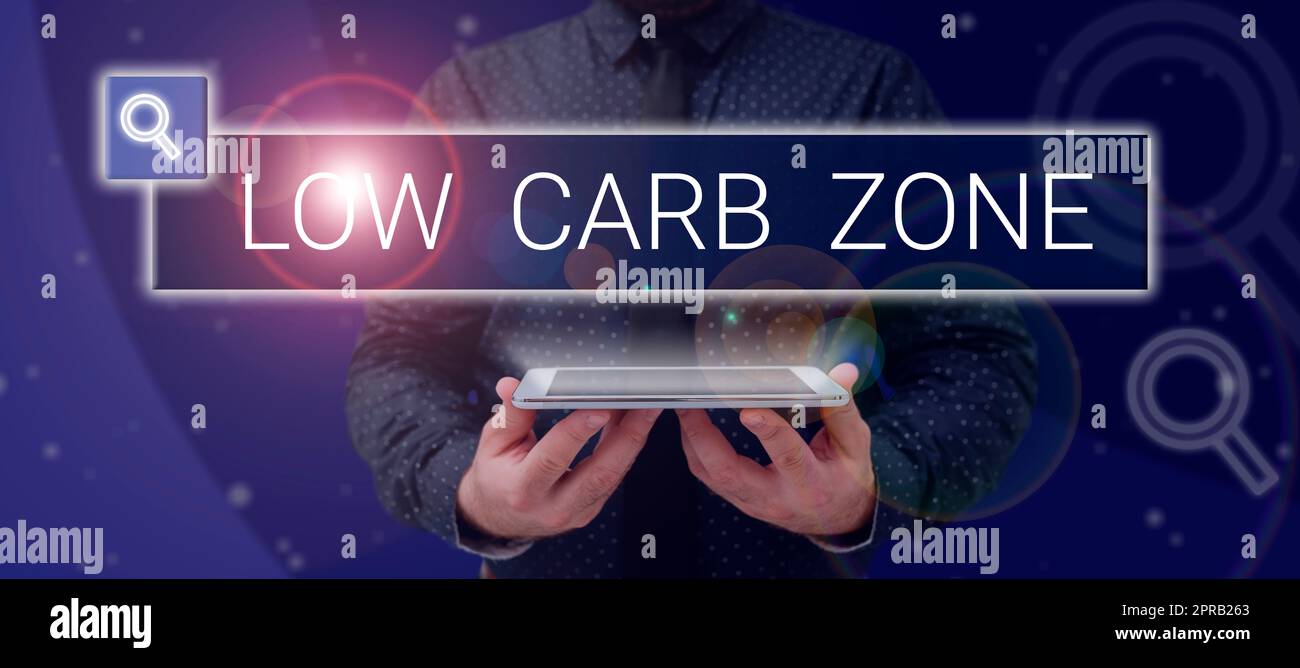 Conceptual caption Low Carb Zone. Business idea Healthy diet for losing weight eating more proteins sugar free Man Holding A Tablet Projecting A Camera Showing Creative Photography. Stock Photo