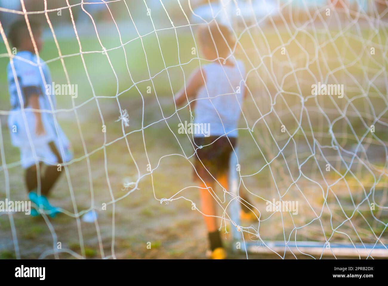 A young Colombian female football player leans against the goal post bar during a training session in Necoclí, Antioquia, Colombia. Stock Photo