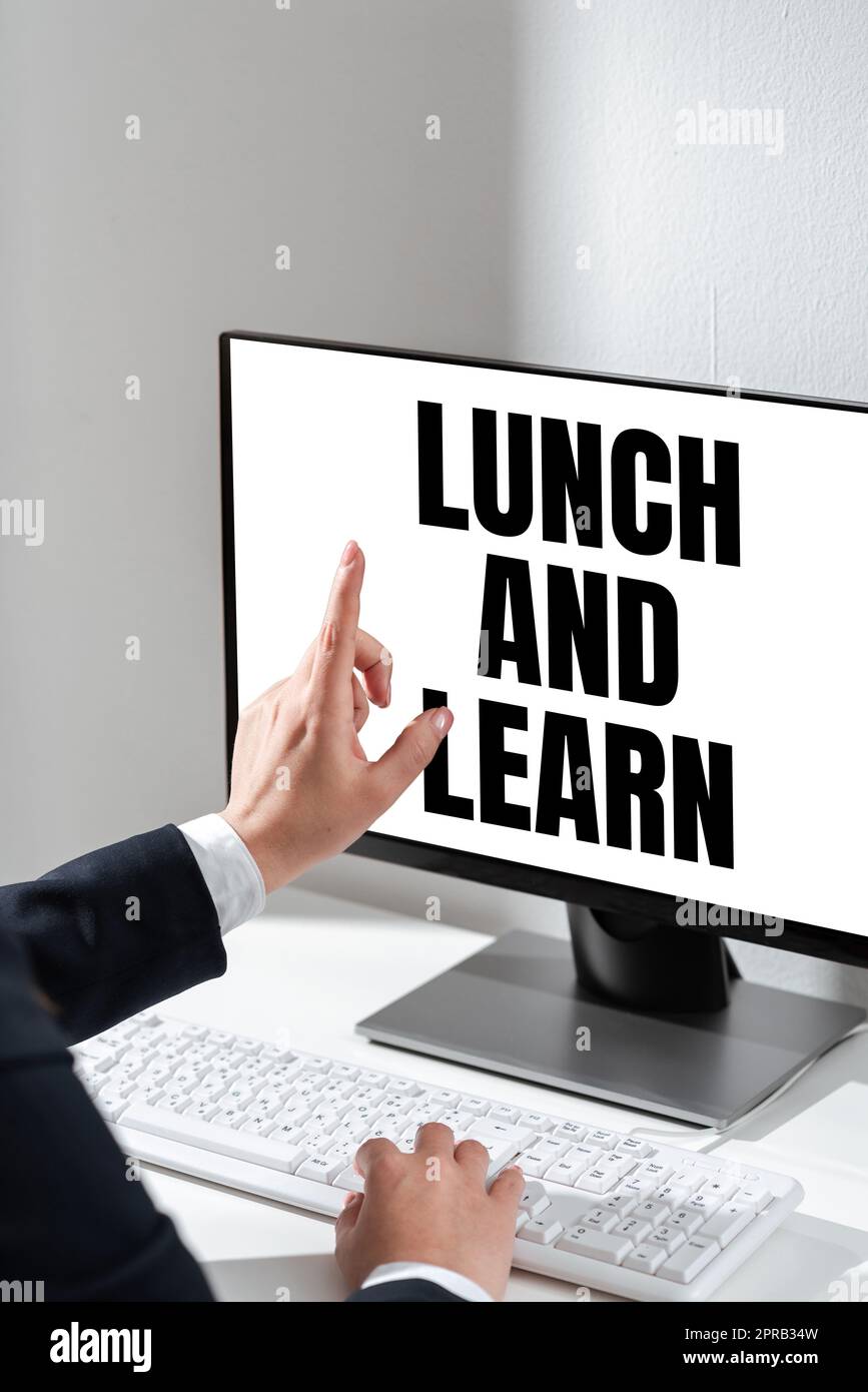 Text showing inspiration Lunch And Learn. Business approach Have meal and study motivation for education learning eating Woman Typing Updates On Lap Top And Pointing New Ideas With One Finger. Stock Photo