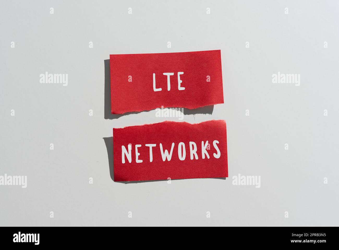Conceptual caption Lte Networks. Business concept Fastest network connection available for wireless communication Ripped Sticky Note With Important Messages Presented On Desk. Stock Photo