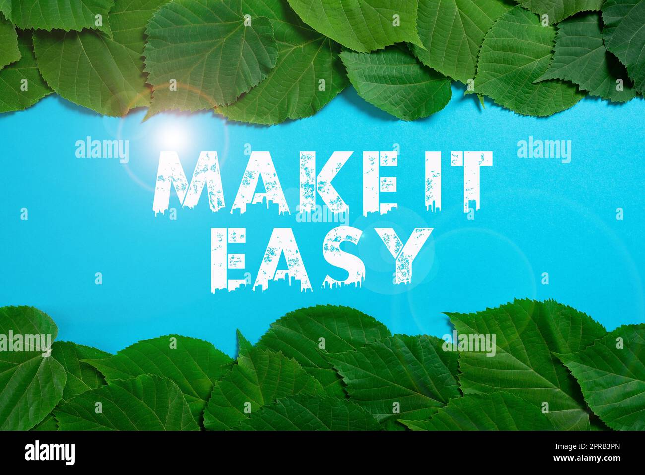 Text showing inspiration Make It Easy. Internet Concept Smart approach Effortless Free from worries or difficulties Important Informations Written On Paper Under Lot Of Leaves. Stock Photo
