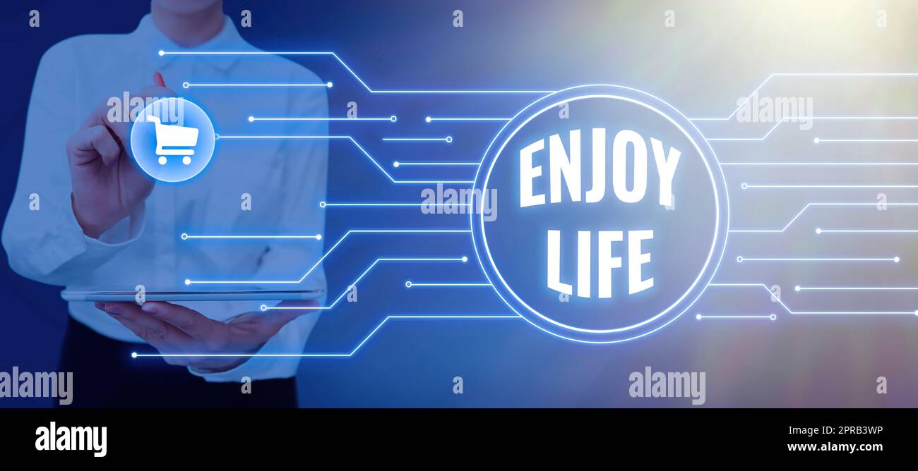 Conceptual display Enjoy Life. Concept meaning Any thing, place,food or person, that makes you relax and happy Businessman in suit holding notepad symbolizing successful teamwork. Stock Photo