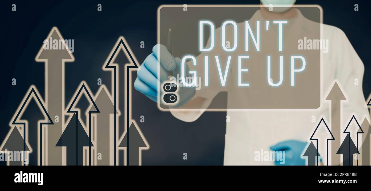 Inspiration showing sign Don T Give Up. Internet Concept Keep trying until you succeed follow your dreams goals Doctor Pointing Pen On Digital Display With Arrows Moving Up. Stock Photo