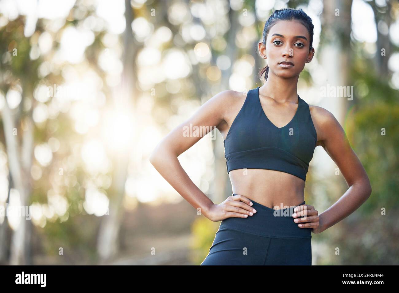 Dont limit your challenges - challenge your limits. Portrait of a sporty young woman exercising outdoors. Stock Photo