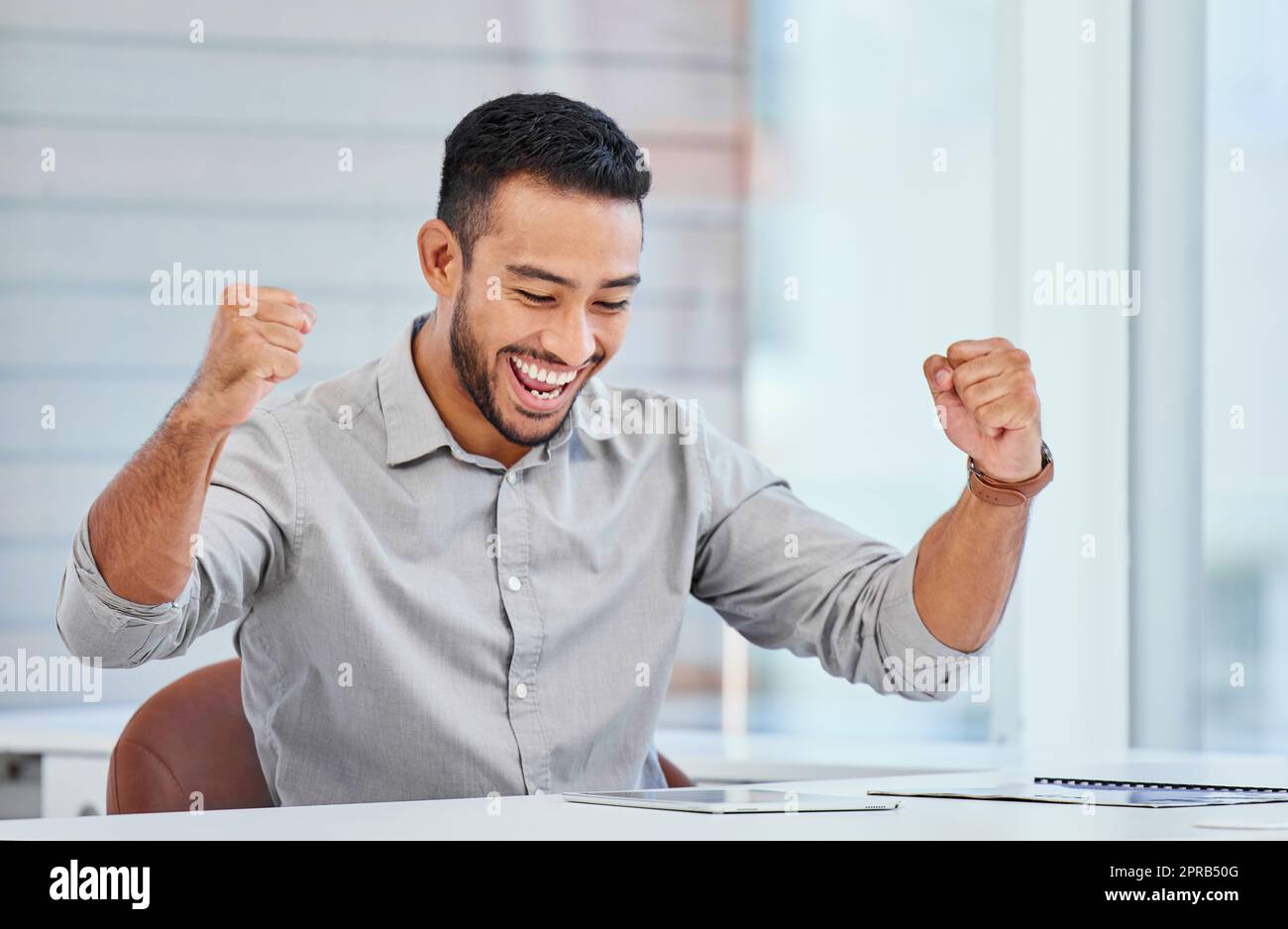 Im so proud of myself. a young businessman cheering to his success at work. Stock Photo