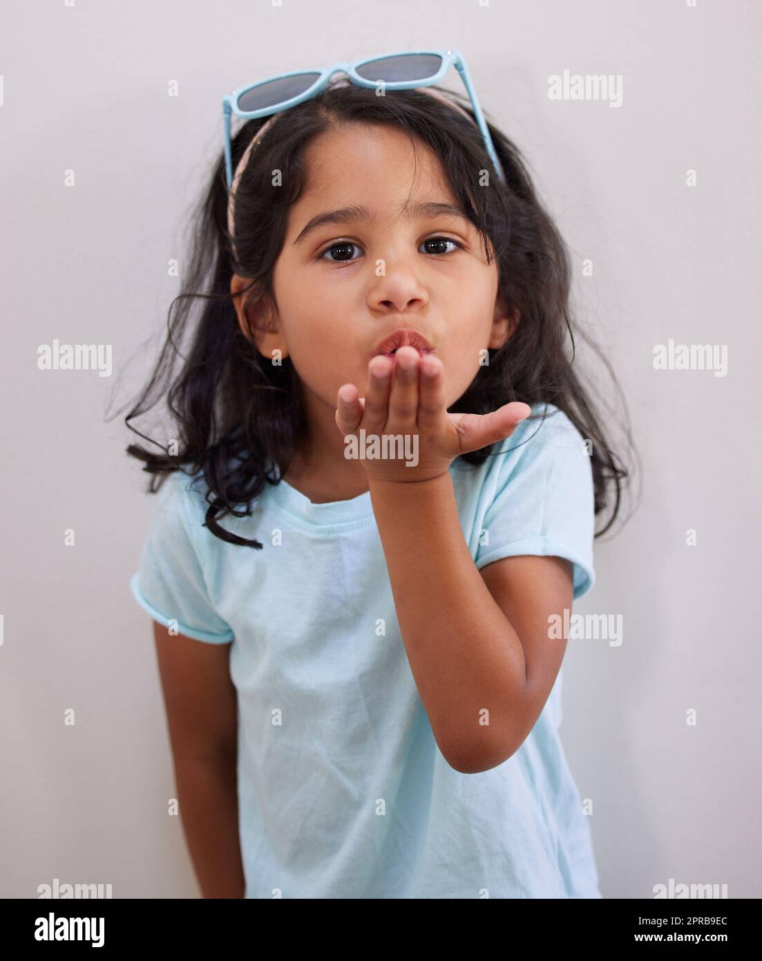 Im blowing some kisses your way. an adorable little girl blowing a kiss