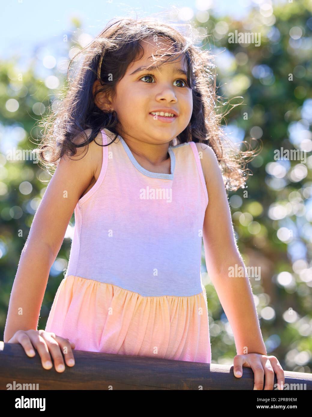 The playground is my favourite place. an adorable little girl spending time outside. Stock Photo