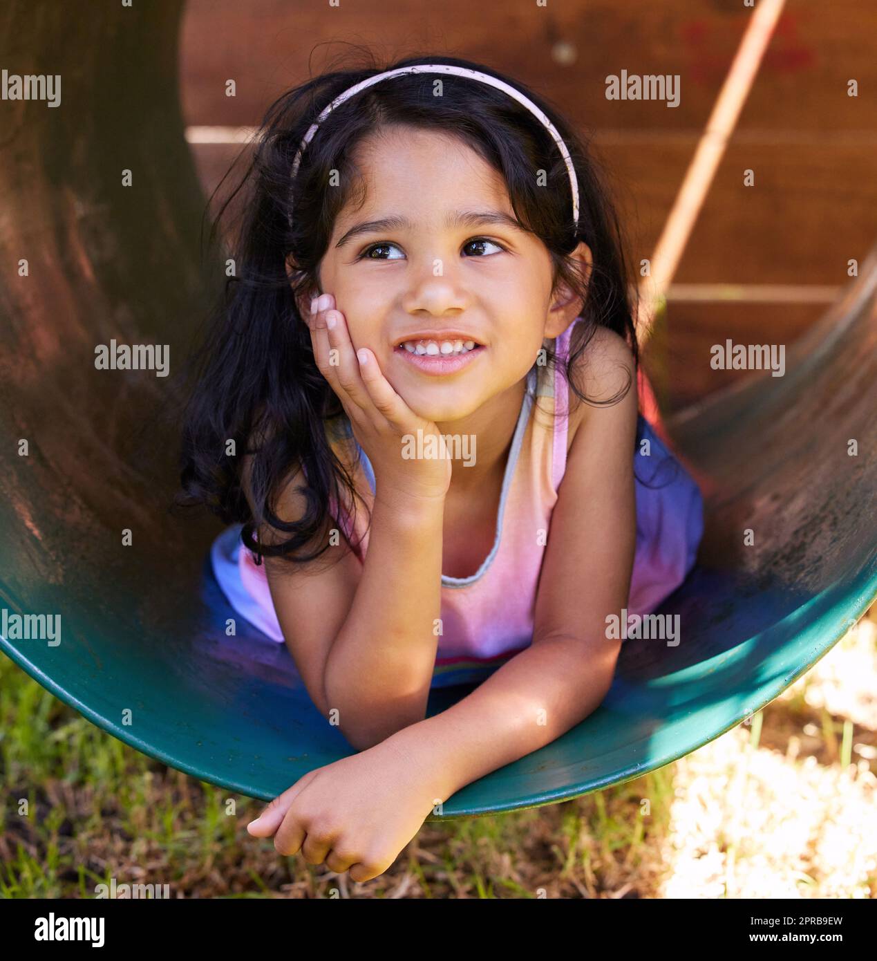 Whats on you mind little one. an adorable little girl spending time outside. Stock Photo