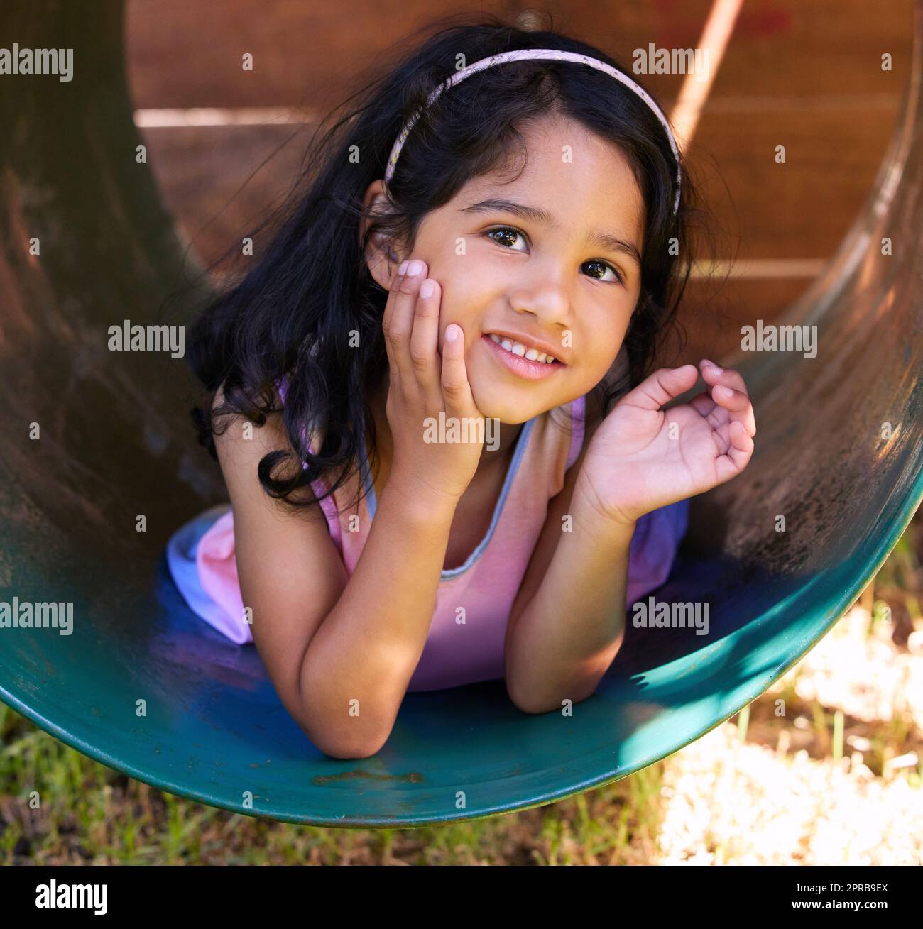 Im here to make you smile. an adorable little girl spending time outside. Stock Photo