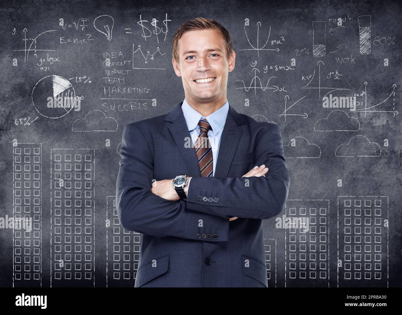 Business man working in finance and standing with arms crossed looking proud, happy and smiling in front of a chalkboard with cgi data. Portrait of a cheerful, joyful and expert accountant advisor Stock Photo