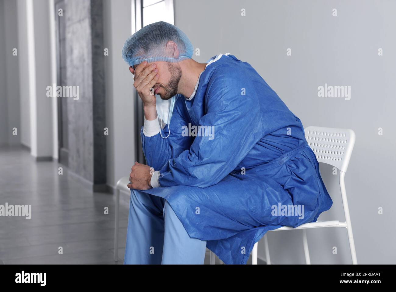 Doctor sitting on chair hi-res stock photography and images - Alamy