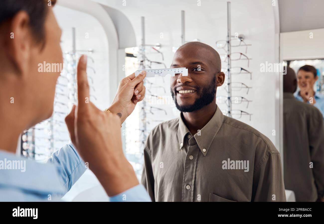 Optometrist examining a patients eye hi-res stock photography and ...