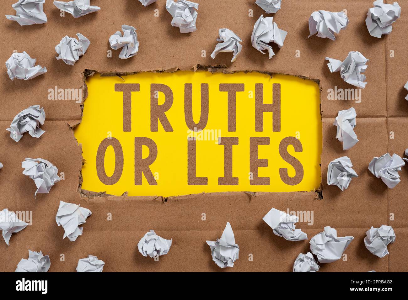 Inspiration showing sign Truth Or Lies. Business approach Decide between a fact or telling a lie Doubt confusion Important Ideas Written Under Ripped Cardboard With Paper Wraps Around. Stock Photo