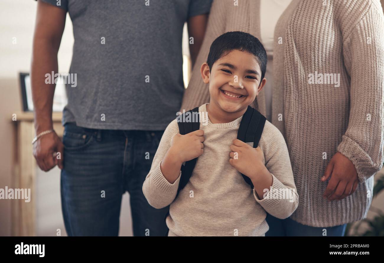 Nobody forgets their first day of school. Portrait of an adorable little boy ready to go to school with his parents. Stock Photo
