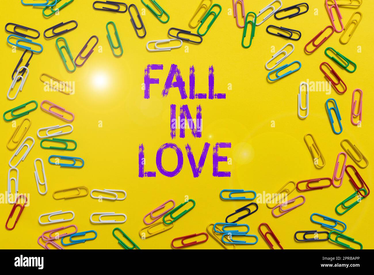 Handwriting text Fall In Love. Business concept Feeling loving emotions about someone else Romance Happiness Colored Clips Arranged In Circle With Crutial Announcement Inside. Stock Photo