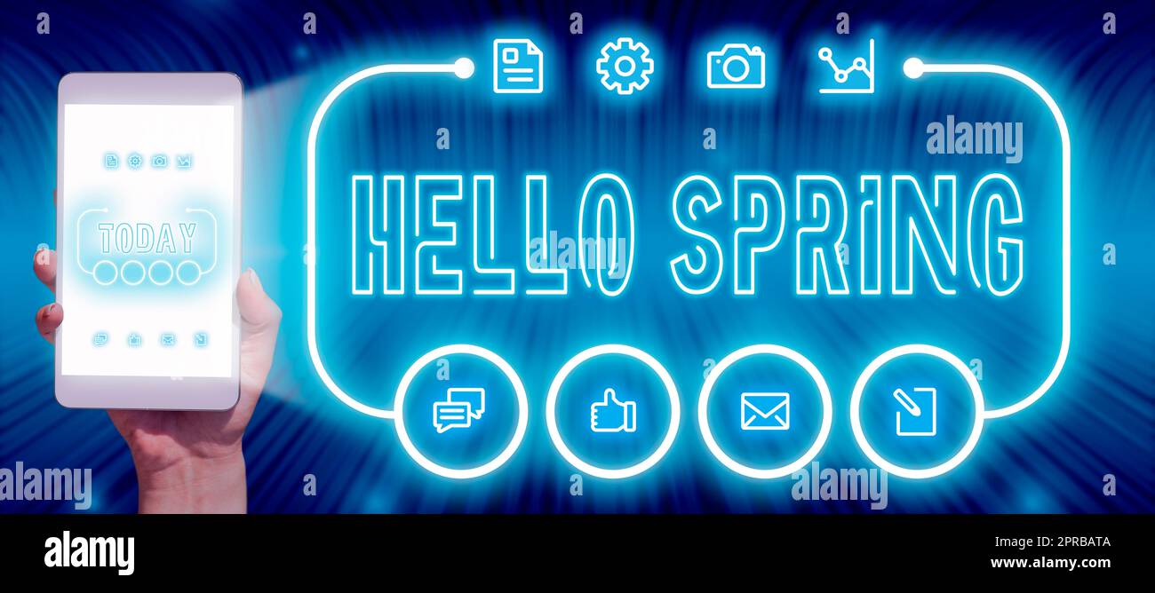 Text showing inspiration Hello Spring. Conceptual photo Welcoming the season after the winter Blossoming of flowers Businessman Holding A Tablet With Glowing Digital S In A Futuristic Frame. Stock Photo