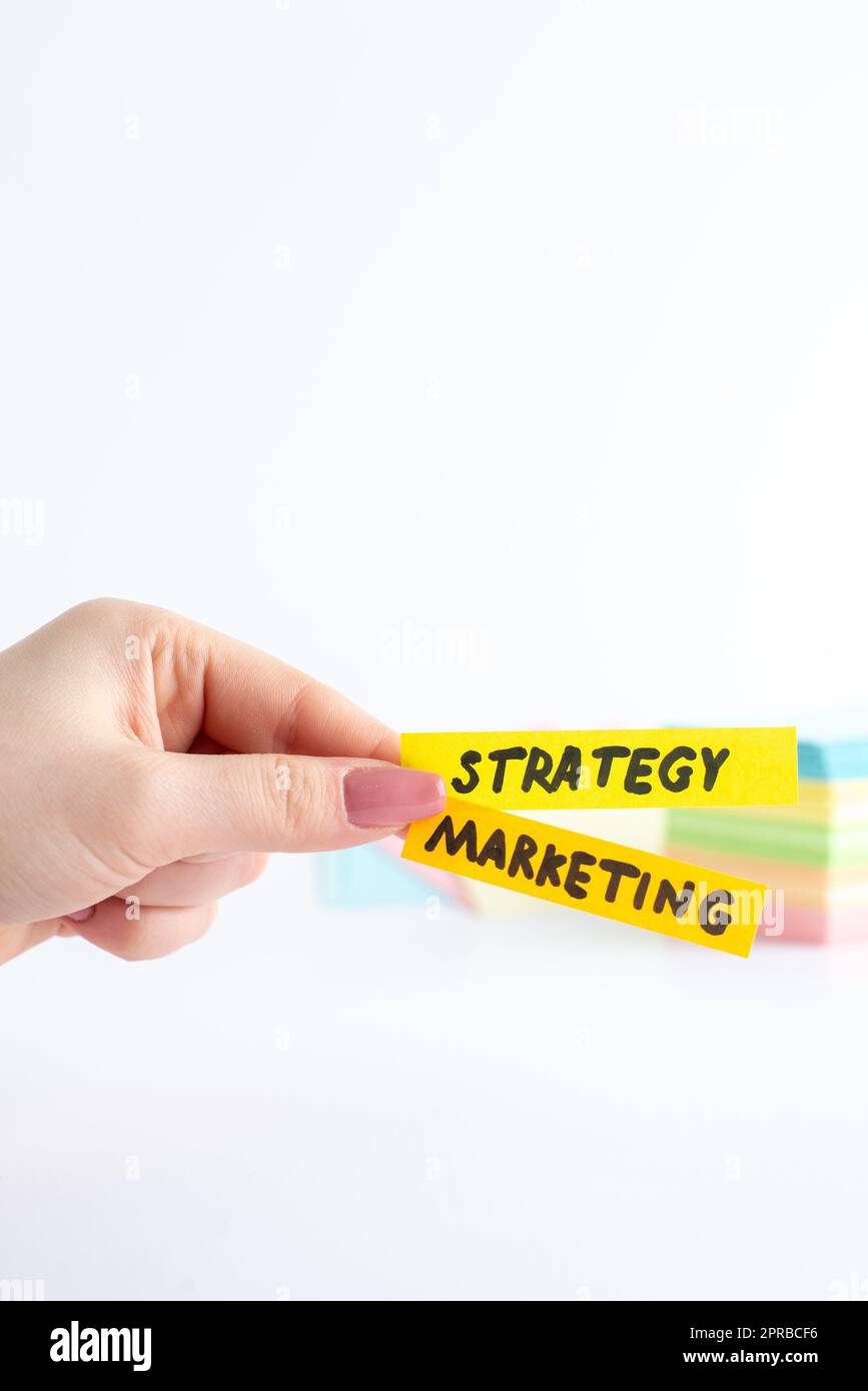 front view strategy marketing little stickers in female hands on white ...