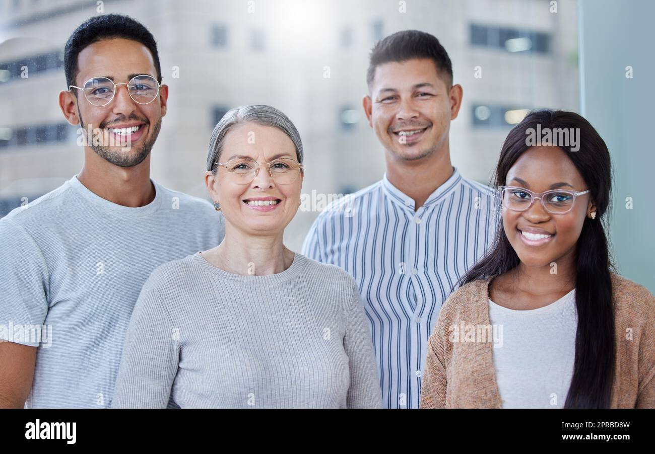 Im extremely proud of my team. a diverse team of coworkers together in their office at work. Stock Photo