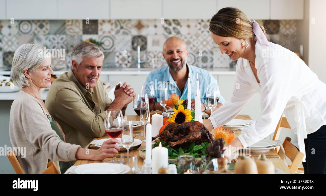 Good cheer, good friends, good times. two couples sitting down for lunch at home. Stock Photo