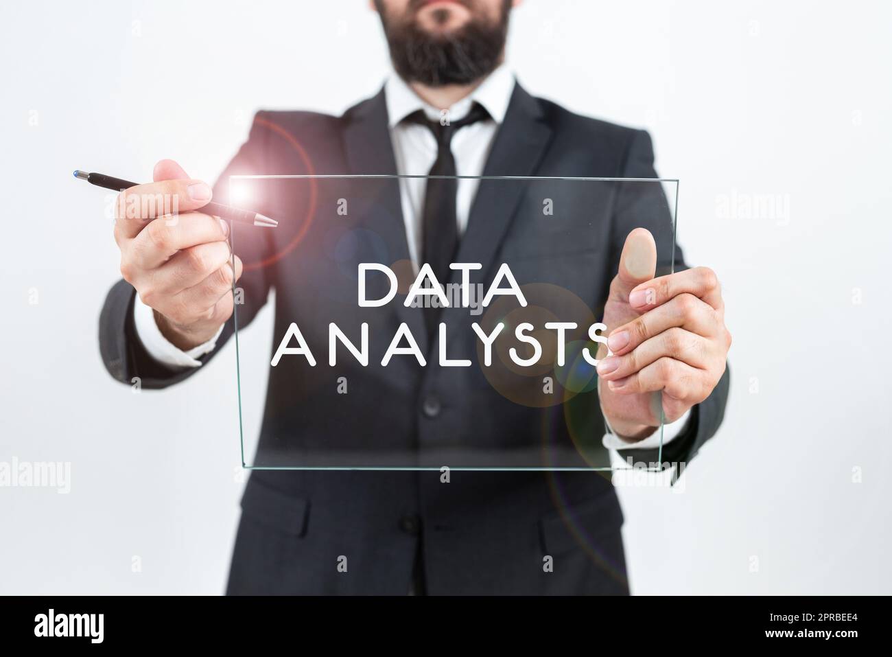 Handwriting text Data Analysts. Word for Programmer Design and Create Report Identifies patterns Businessman Holding Pen And Glass While Promoting The Company Brand. Stock Photo