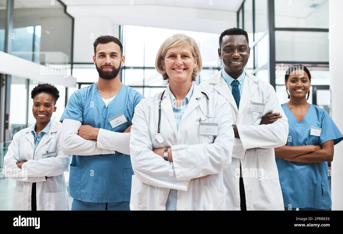Let us guide you to good health. Portrait of a group of medical practitioners standing together in a hospital. Stock Photo