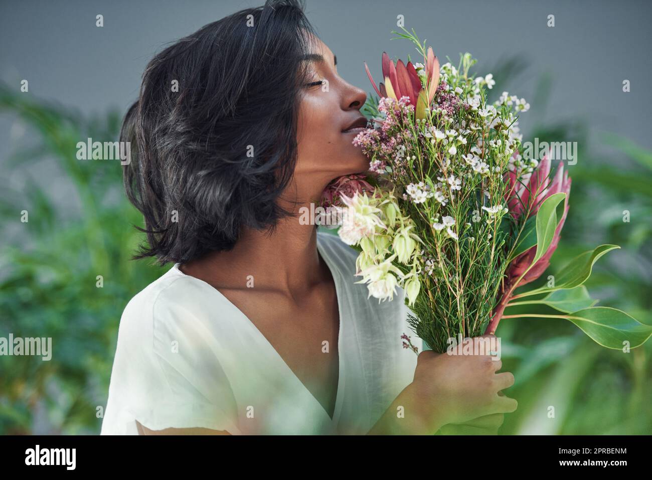 Smelling their fragrance has the power to stop time. a beautiful young