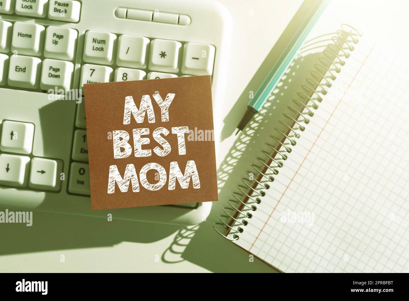 Hand writing sign My Best Mom. Business overview Admire have affection good feelings love to your mother Important Messages Written On Note On Desk With Pen, Notebook And Keyboard. Stock Photo