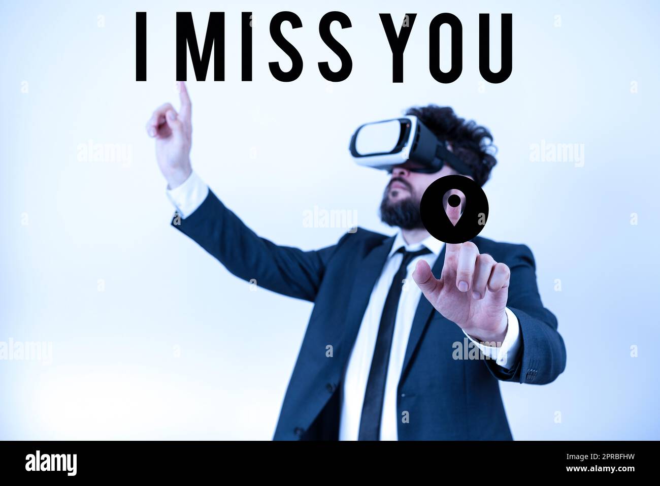 Text caption presenting I Miss You. Internet Concept Feeling sad because you are not here anymore loving message Man Wearing Vr Glasses And Pointing On Important Messages With Both Hands. Stock Photo