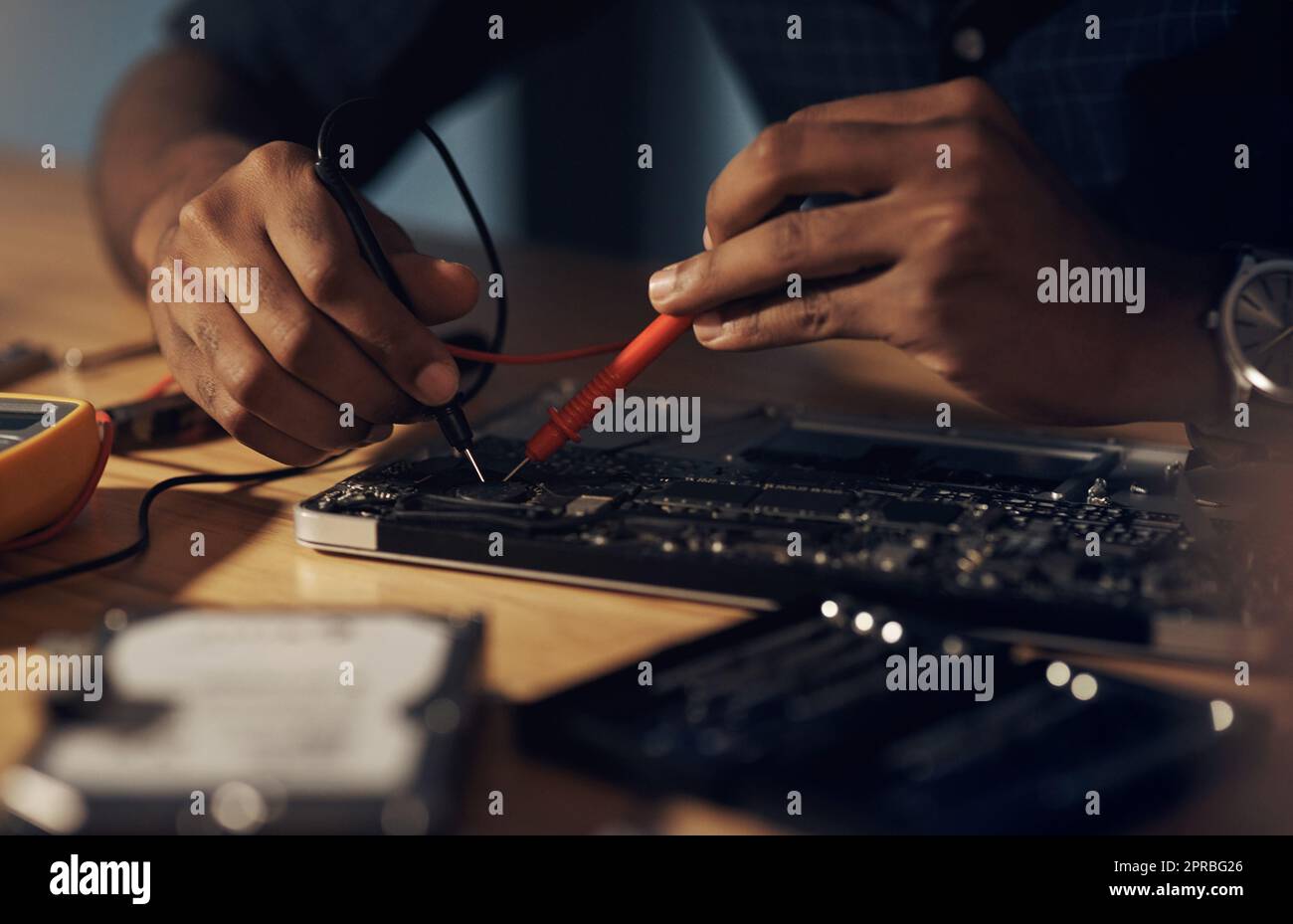 Nothing is too faulty for his expert hands. an unrecognisable technician repairing computer hardware. Stock Photo