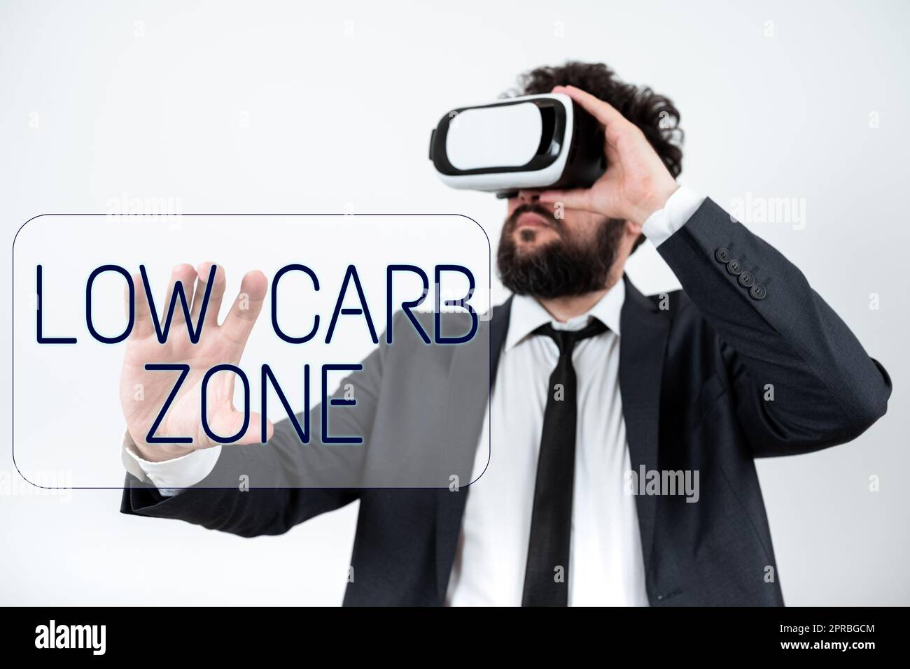 Sign displaying Low Carb Zone. Business idea Healthy diet for losing weight eating more proteins sugar free Man Wearing Vr Glasses And Presenting Important Messages With One Hand. Stock Photo
