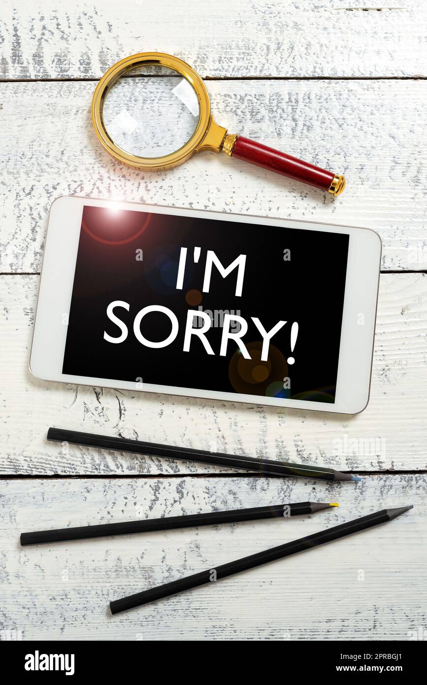 Inspiration showing sign I Am Sorry. Business showcase Toask for forgiveness to someone you unintensionaly hurt Tablet Screen With New Ideas With Magnifier And Pencils Around. Stock Photo