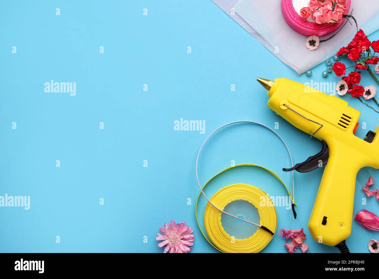 Woman make floral decor with melt glue gun Stock Photo - Alamy